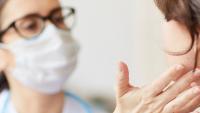 doctor doing a medical examination of a female patient